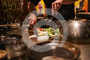 Teppanyaki Chef Cooking and Cutting Up Vegetables