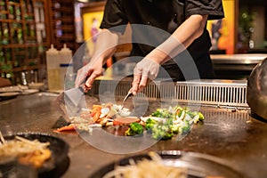 Teppanyaki Chef Cooking and Cutting Up Vegetables