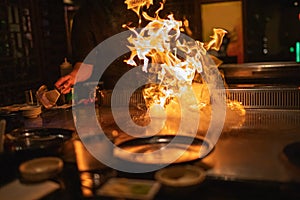 Teppanyaki Chef Cooking With Flames