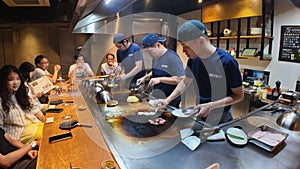 Teppanyaki iron griddle cook food worker