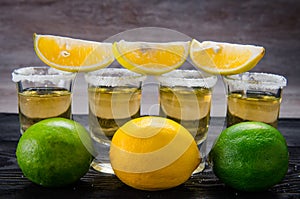 The tequila drink served in glasses with lime and salt