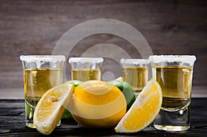 The tequila drink served in glasses with lime and salt