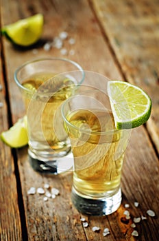 Tequila in glasses with lime and salt