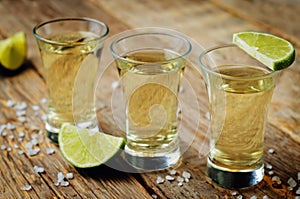 Tequila in glasses with lime and salt