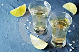 Tequila in glasses with lime and salt