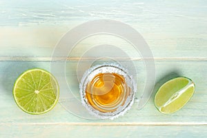 Tequila with lime, a Mexican drink with a salt rim, shot from above