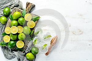 Tequila with salt and lime on a white wooden background. Fruits. Top view.