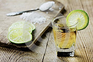 Tequila shot with lime and salt photo
