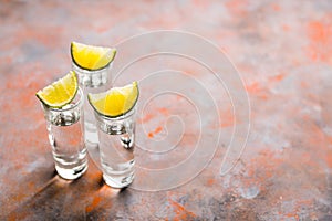 Tequila shots on the dark rustic background