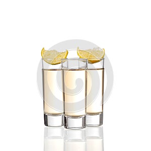 Tequila shots with lime isolated on white background