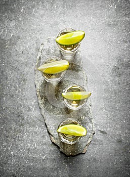 Tequila shots with lime and salt .