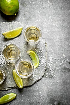 Tequila shots with lime and salt .