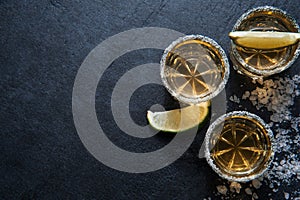 Tequila shots with lime slice, top view photo