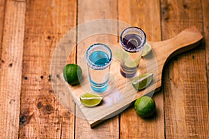 Tequila shots with salt and lime on a bar table