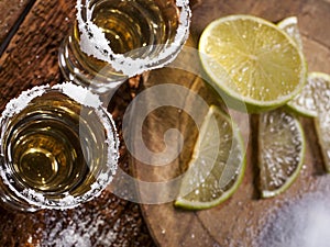 Tequila shots on wooden background