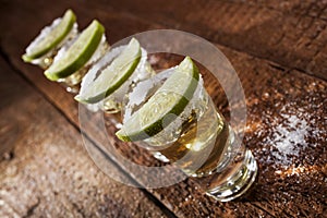 Tequila shots on wooden background