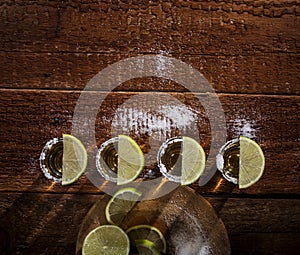 Tequila shots on wooden background