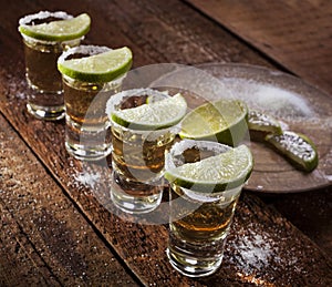 Tequila shots on wooden background