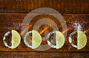 Tequila shots on wooden background