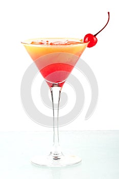 Tequila sunrise alcohol cocktail with maraschino
