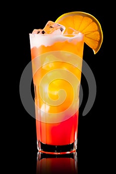Tequila Sunrise cocktail blend of tequila, orange juice, and grenadine on black