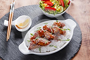 Teriyaki chicken with rice and salad japanese cuisine