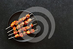 Teriyaki chicken skewers on plate