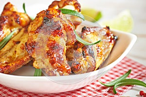 Teriyaki chicken wings. Baked chicken with fresh rosemary. Homemade food. Symbolic image.