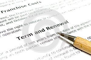 Term and renewal with wooden pen photo