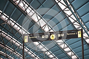 Terminal 1 and 2 signs in airport interior