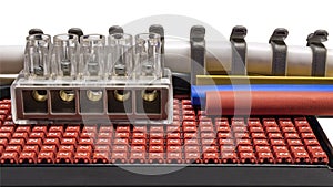 Terminal blocks and distribution blocks. Connecting electrical cables of different voltages. Connection to an electrical terminal