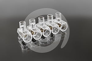 Terminal blocks and distribution blocks. Connecting electrical cables of different voltages. Connection to an electrical terminal