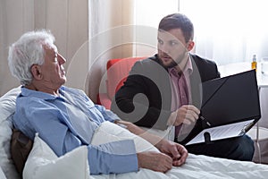 Terminal patient talking with notary