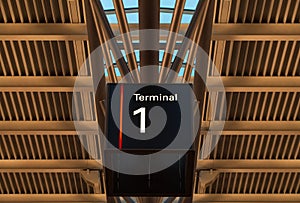 Terminal sign at the airport under roof photo