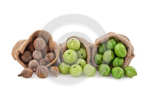 Terminalia bellirica, Terminalia chebula and Phyllanthus emblica fruits in sack isolated on white background with clipping path