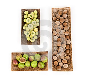 Terminalia bellirica , terminalia chebula and phyllanthus emblica or triphala isolated on white background.top view ,flat lay