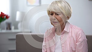 Terminally ill senior lady suffering depression, fatal disease health problems