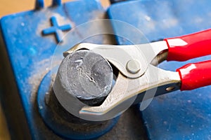 Terminals of the old dirty battery. Charging car battery with electric current.