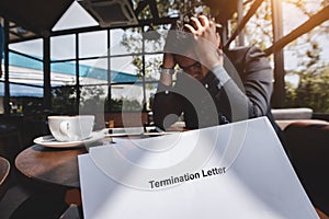 Termination of Employment and layoff concept, Stressed businessman feeling down after received Termination photo