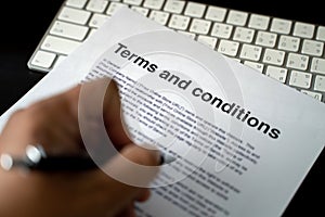 Terms and conditions businessman reviewing  terms and conditions of agreement office terms and conditions