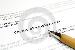 Terms of employment with wooden pen photo