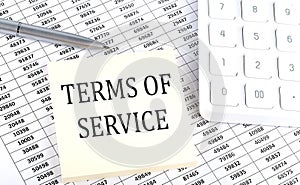 TERMS OF SERVICE - business concept, message on sticker on chart background