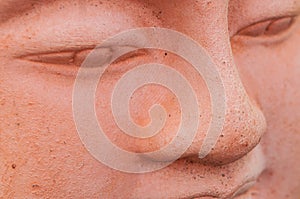 terra cotta buddha face
