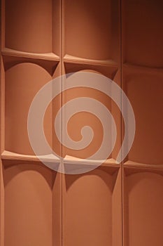 Terra-cotta colored stage acoustic paneling