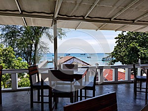 Terrace balcony restaurant thailand tropical chairs seat roof on top view asia sea ocean beach ships port thailand samui
