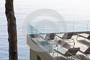 Terrace with bathing buns facing Mediterranean sea  in Camogli, a fishing village and resort close to the peninsula of Portofino