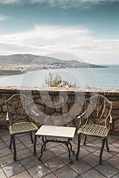 Terrace with chairs and table, Sorrento peninsula, Italy