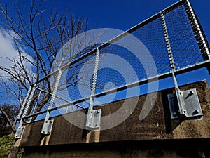 Terrace fencing, railings of metal pipes filled with steel cables