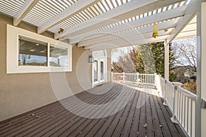 Terrace of a house with sliding windows and arched doorframe