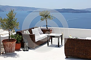 Terrace overlooking sea, Oia, Santorini, Greec photo